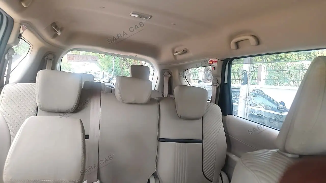 The second and third rows of seats, seen from the front of the cabin